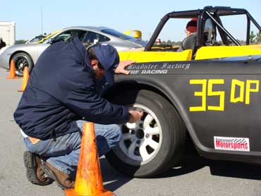 Jaimie Bell checks tire